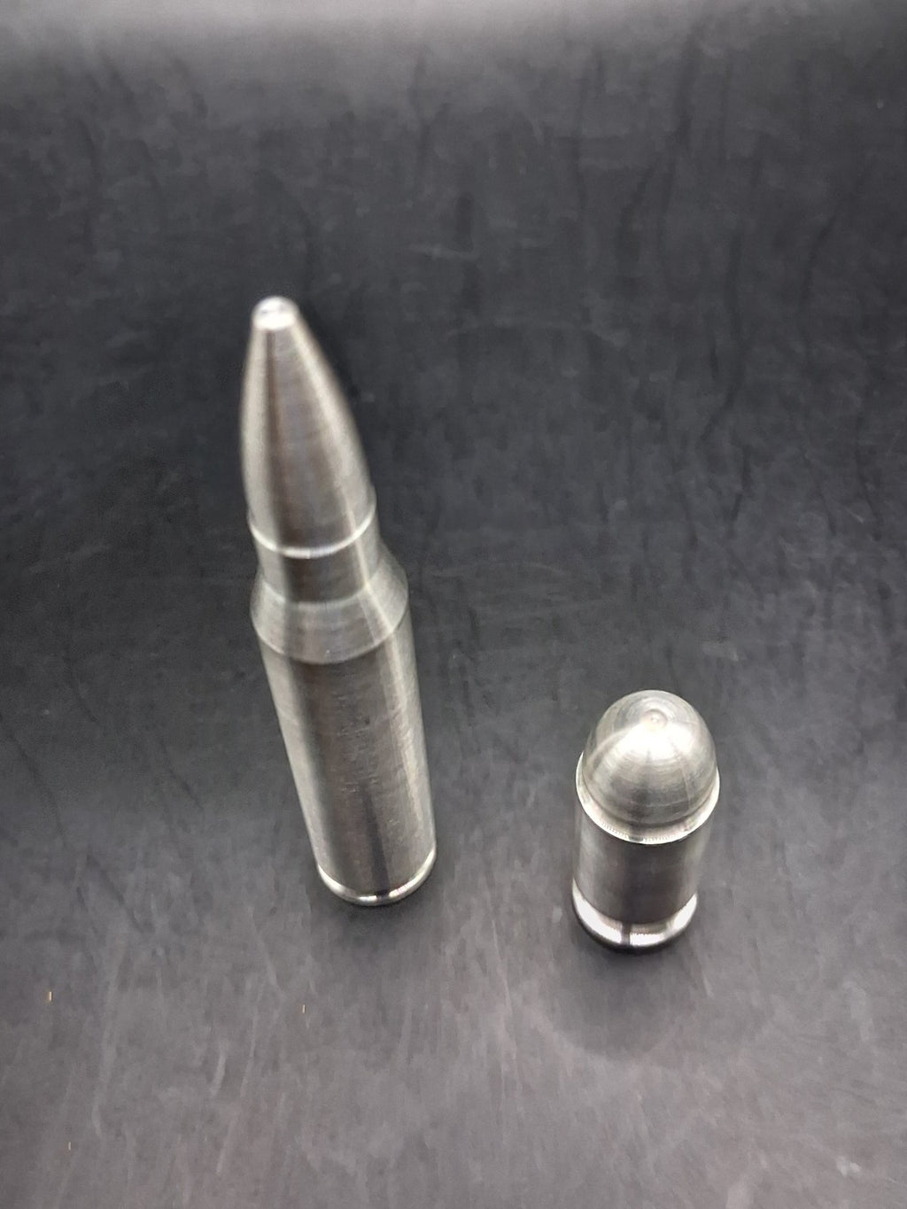 Lot of 2 Silver Bullet Bullion .999 Fine .308/.556 2oz + .45 Auto ACP 3oz Total