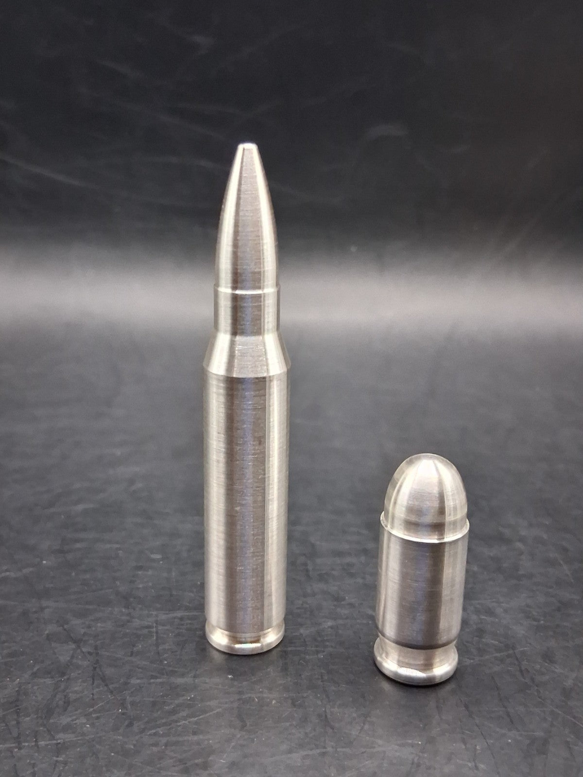 Lot of 2 Silver Bullet Bullion .999 Fine .308/.556 2oz + .45 Auto ACP 3oz Total